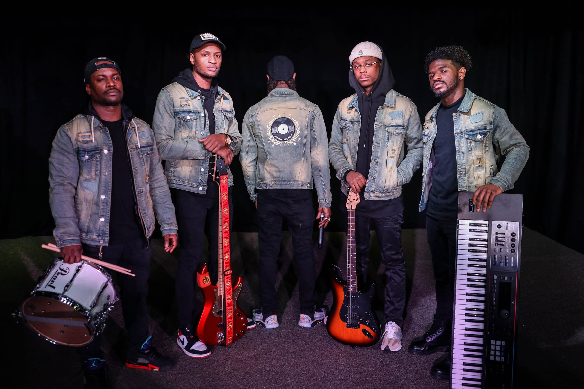 Paul Neil and four bandmates in matching denim jackets